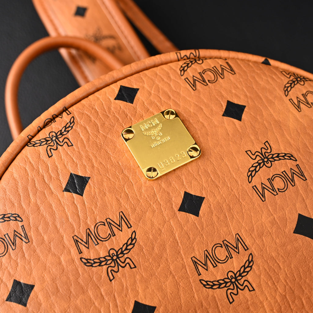 MCM Stark Visetos Medium Backpack – Cognac Monogram with Gold-Tone Studs