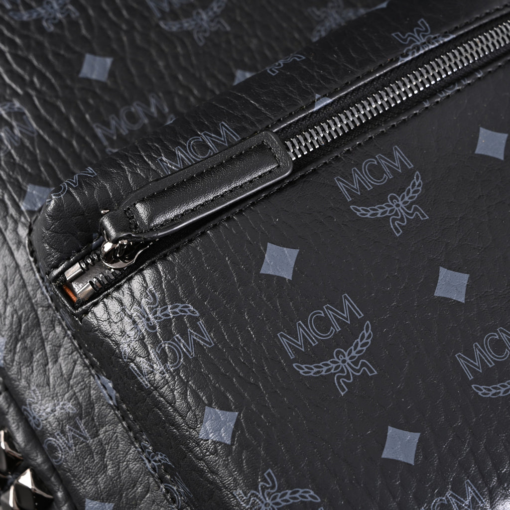 MCM Stark Visetos Medium Backpack – Black Monogram with Studded Detailing