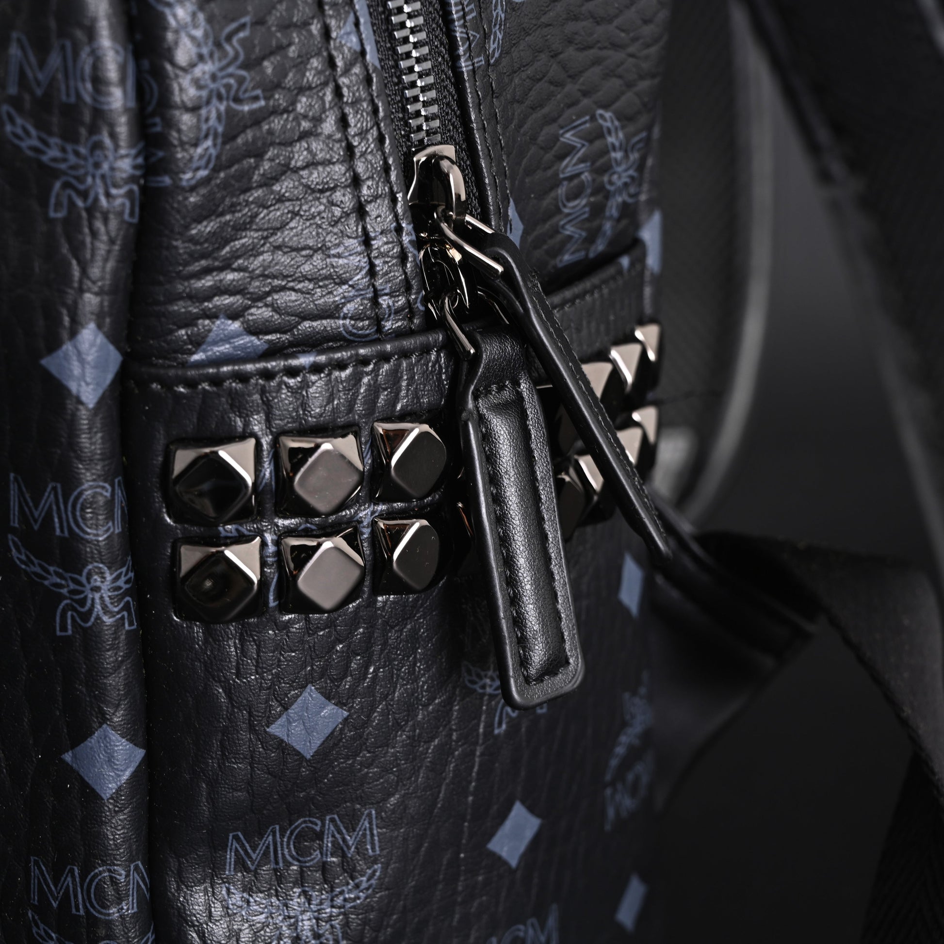 MCM Stark Visetos Medium Backpack – Black Monogram with Studded Detailing