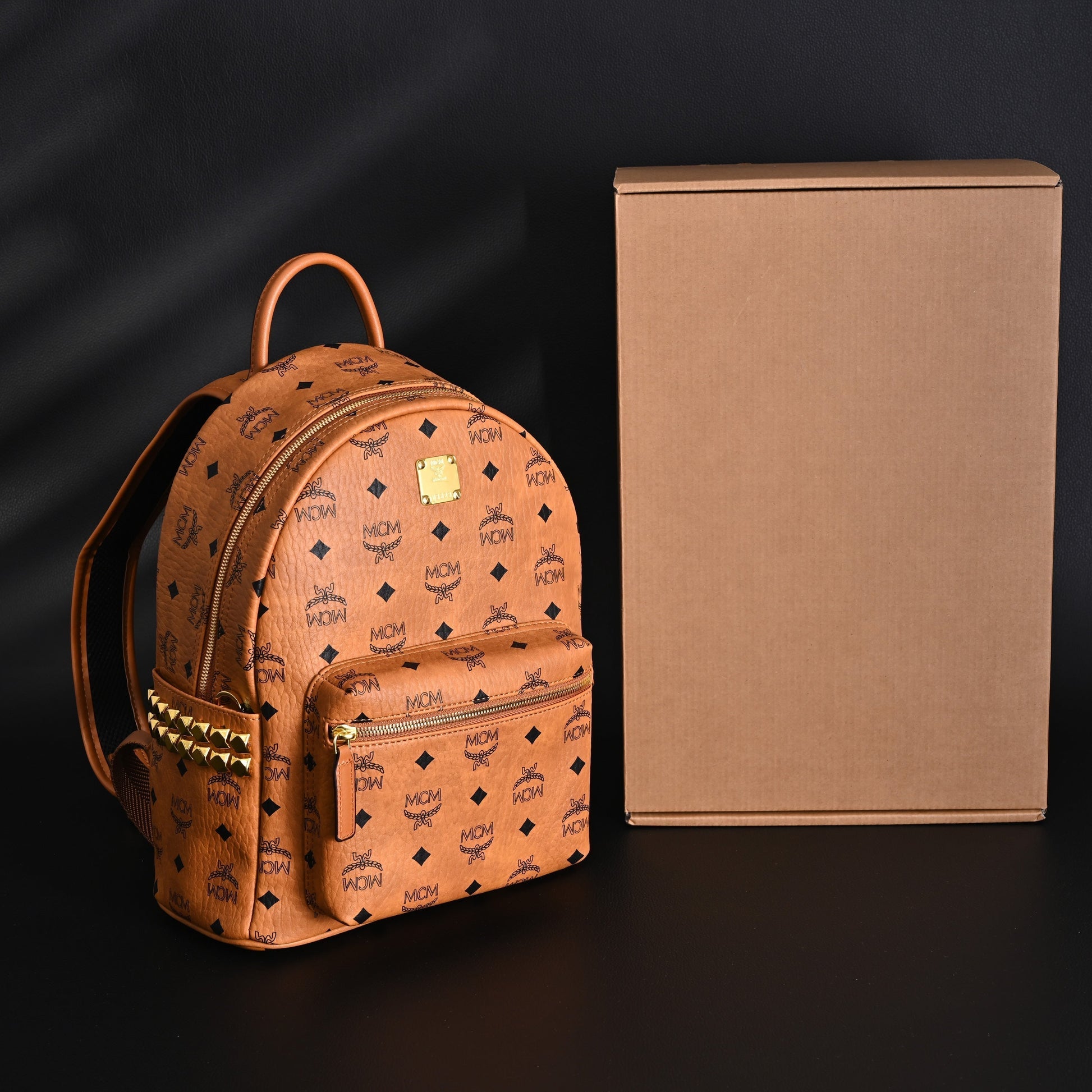 MCM Stark Visetos Medium Backpack – Cognac Monogram with Gold-Tone Studs