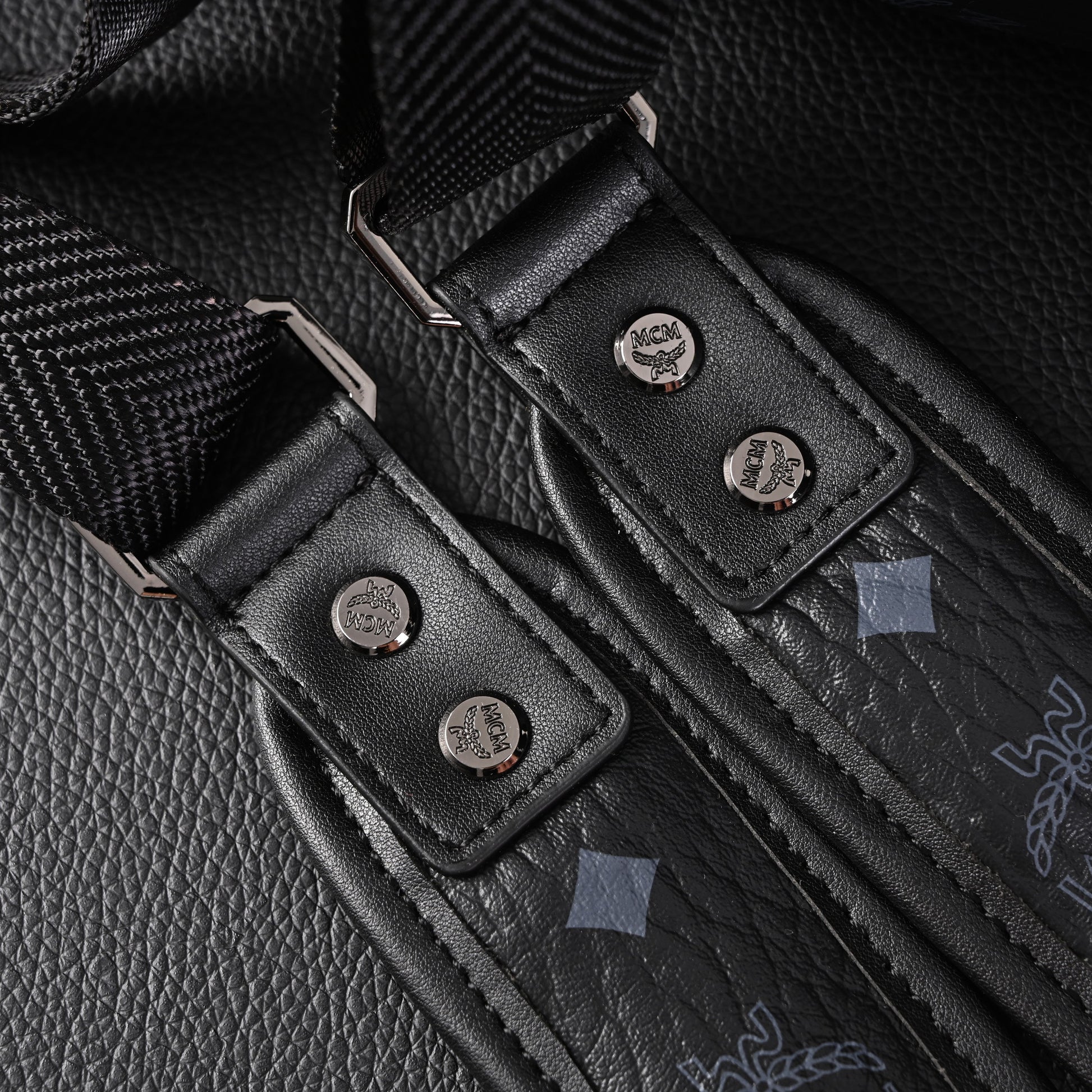 MCM Stark Visetos Medium Backpack – Black Monogram with Studded Detailing