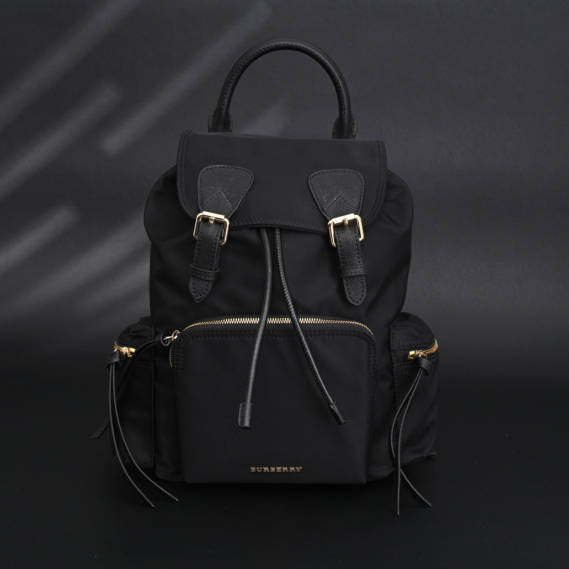 Burberry The Rucksack – Black Nylon & Leather Backpack with Gold-Tone Hardware