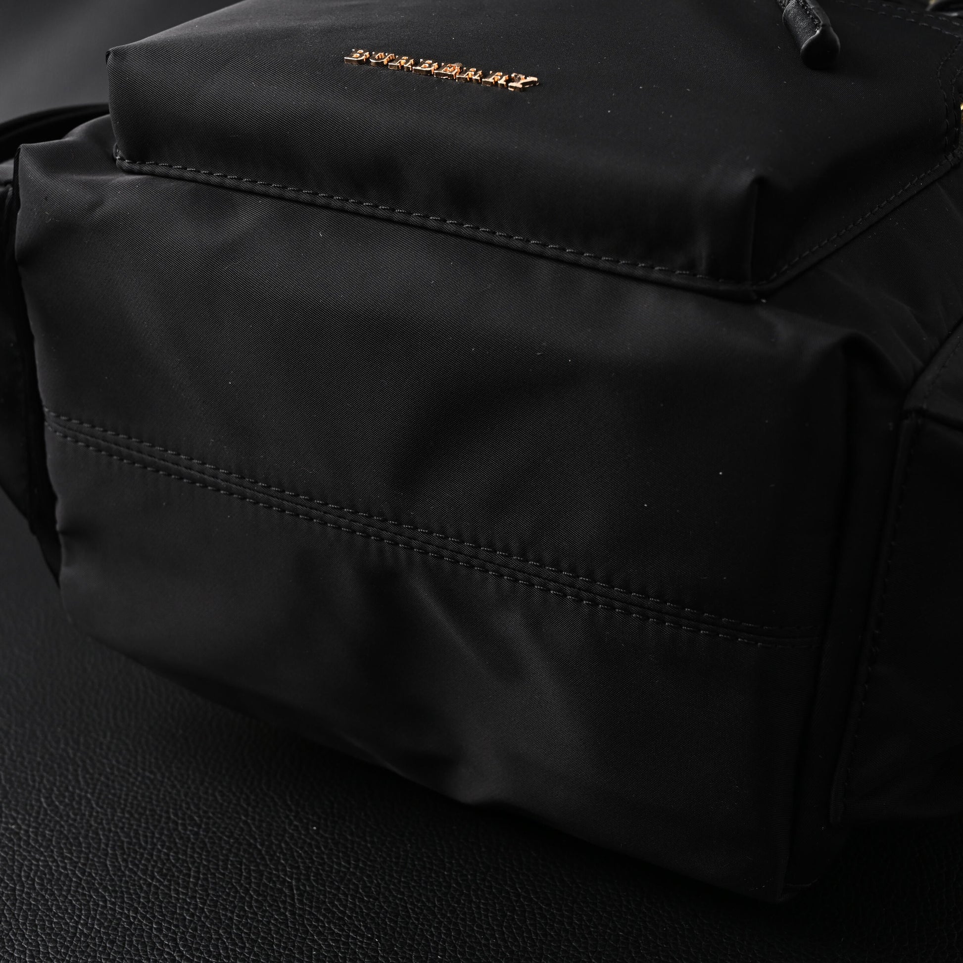 Burberry The Rucksack – Black Nylon & Leather Backpack with Gold-Tone Hardware