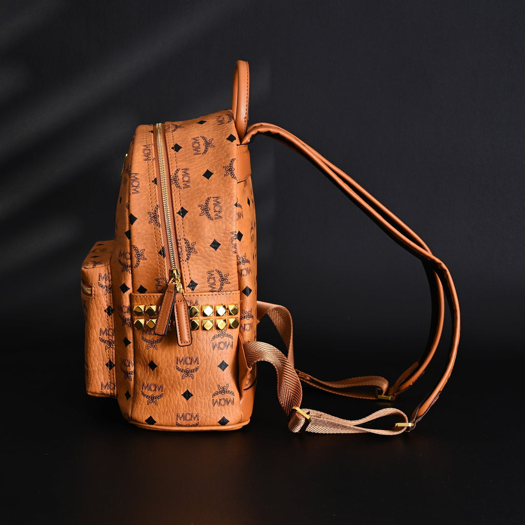 MCM Stark Visetos Medium Backpack – Cognac Monogram with Gold-Tone Studs